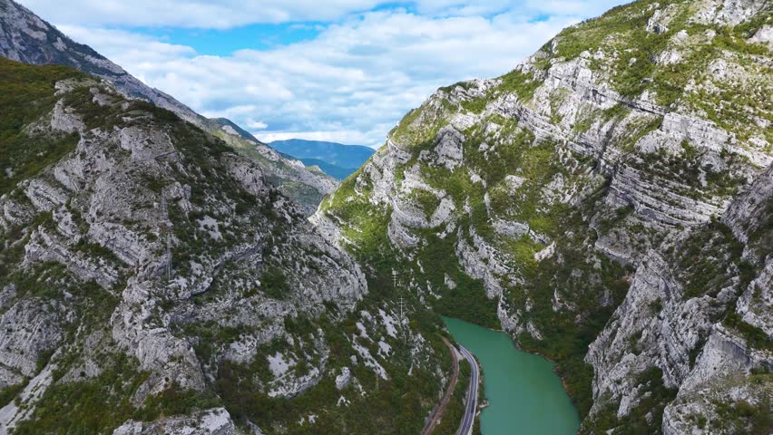 Aerial view of the Dinaric Alps with a winding river and a road running through the canyon in Canton 10, Federation of Bosnia, Bosnia and Herzegovina.