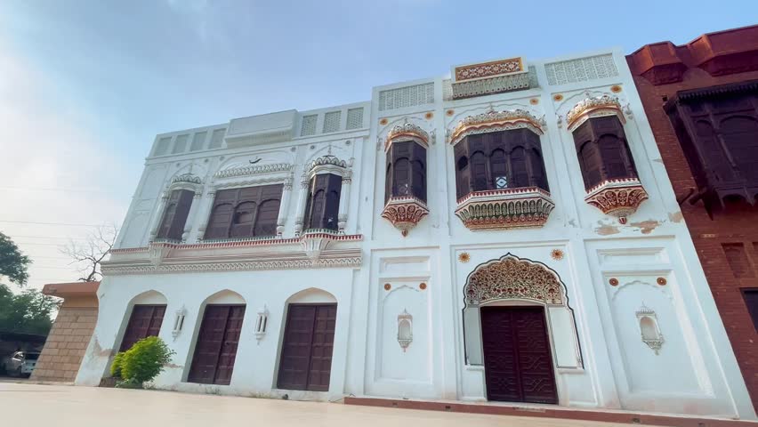 Daytime video showcasing the traditional heritage architecture at Lok Virsa Museum in Islamabad, Pakistan. The beautifully designed cultural building reflects Pakistan