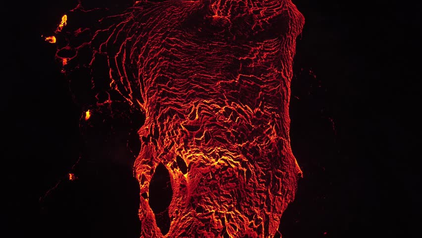 Aerial view of glowing lava flows and cooling crust at the Litli-Hrutur volcanic eruption in Grindavik, Grindavikurbaer, Iceland.