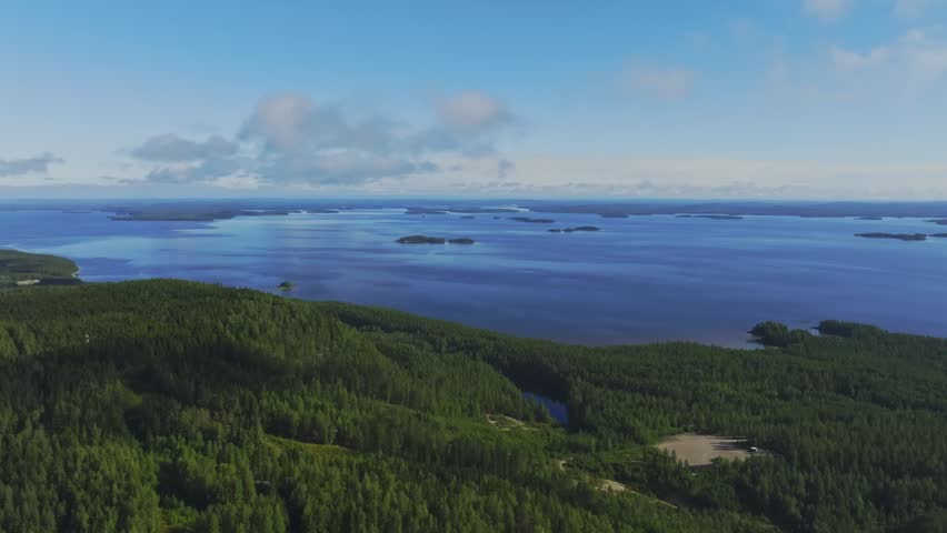 Aerial view of the vast Lake Pielinen surrounded by dense coniferous forests in Koli National Park in Lieksa, North Karelia, Finland.