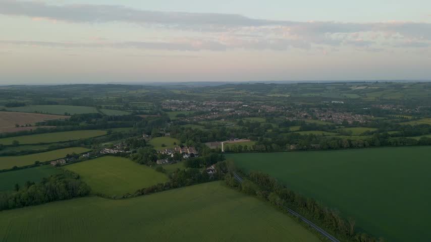 Scenic sunset views of rolling farm fields in the Cotswolds near Bourton-on-the-Water, Gloucestershire, England