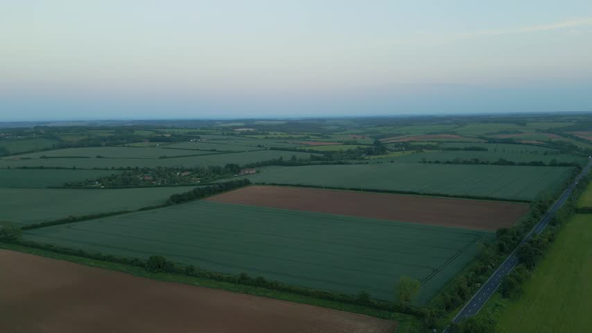 Scenic sunset views of rolling farm fields in the Cotswolds near Bourton-on-the-Water, Gloucestershire, England