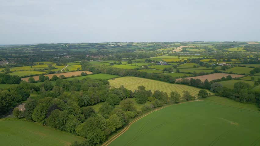Scenic views of rolling farm fields in the Cotswolds near Bourton-on-the-Water, Gloucestershire, England