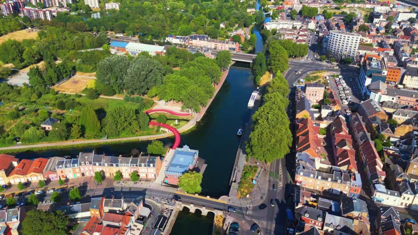 Amiens is a historic northern French city bisected by the Somme River, famous for its floating gardens, brick architecture, vibrant quarters, and rich medieval, industrial, and literary heritage.