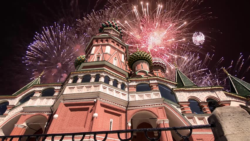 Temple of Basil the Blessed and fireworks in honor of Victory Day celebration (WWII), Red Square, Moscow, Russia. Time lapse, with zoom