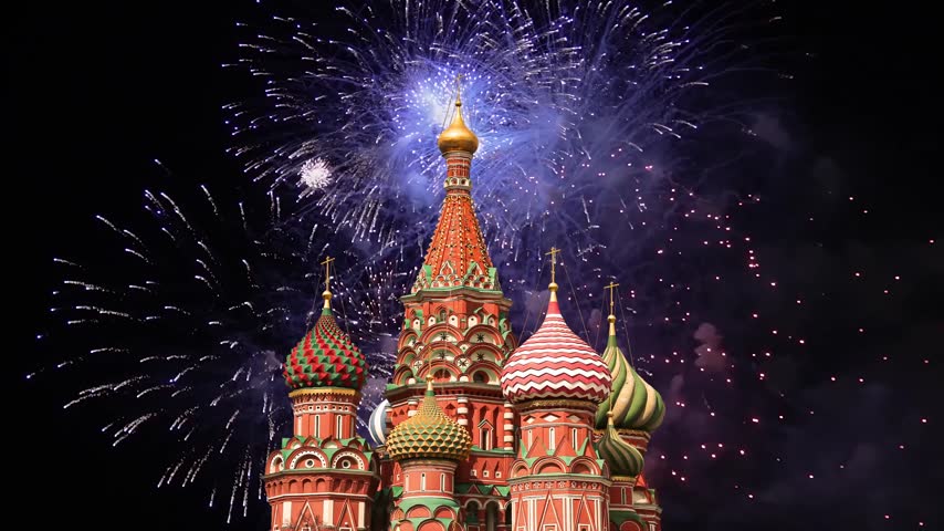 Temple of Basil the Blessed and fireworks in honor of Victory Day celebration (WWII), Red Square, Moscow, Russia. Time lapse, with zoom