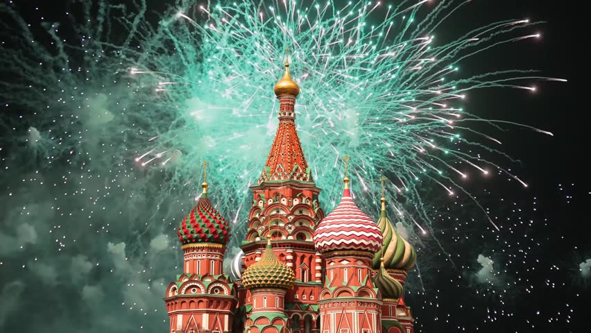 Temple of Basil the Blessed and fireworks in honor of Victory Day celebration (WWII), Red Square, Moscow, Russia. Time lapse, with zoom