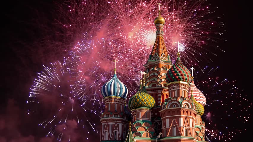 Temple of Basil the Blessed and fireworks in honor of Victory Day celebration (WWII), Red Square, Moscow, Russia. Time lapse, with zoom