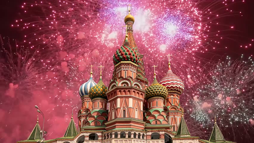 Temple of Basil the Blessed and fireworks in honor of Victory Day celebration (WWII), Red Square, Moscow, Russia. Time lapse, with zoom