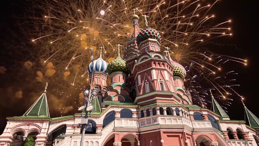Temple of Basil the Blessed and fireworks in honor of Victory Day celebration (WWII), Red Square, Moscow, Russia. Time lapse, with zoom