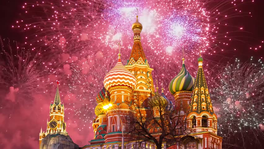 Temple of Basil the Blessed and fireworks in honor of Victory Day celebration (WWII), Red Square, Moscow, Russia. Time lapse, with zoom