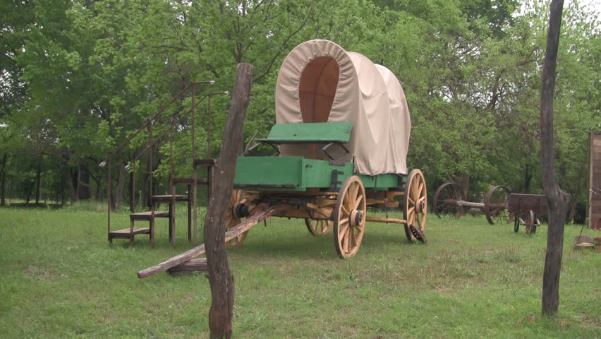 Historic covered wagon ready to board.
