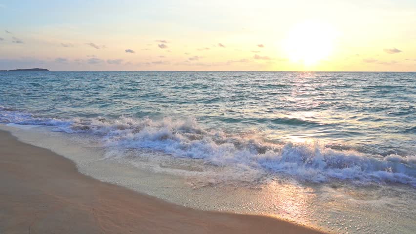 Sunset beach shoreline with ocean waves background