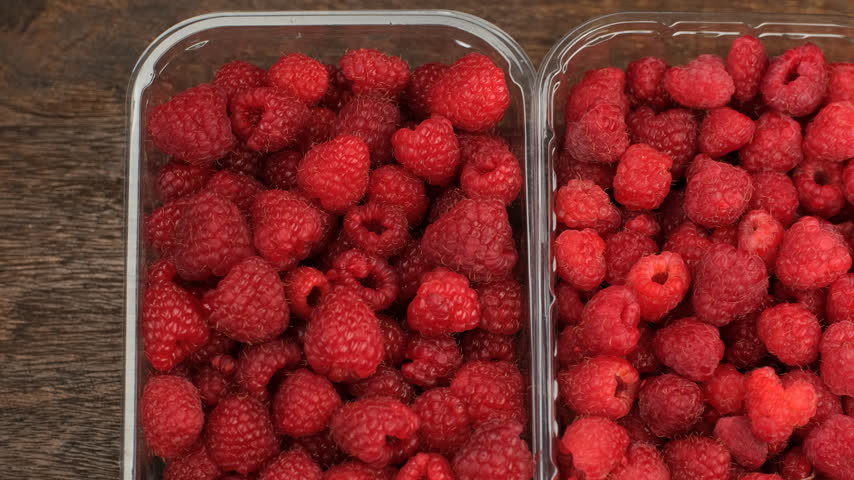 Fresh raspberries in plastic boxes, slider view