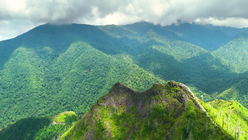 Chimney Tops peaks in Great Smoky Mountains in summer season. Mountain wooded hills in Tennessee Appalachians, USA.