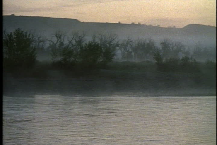 Morning mist over the Little Missouri River at dawn in Theodore Roosevelt National Park in Medora, North Dakota.