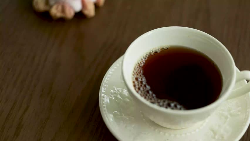 Warm Milk Pouring into Coffee Cup for Latte