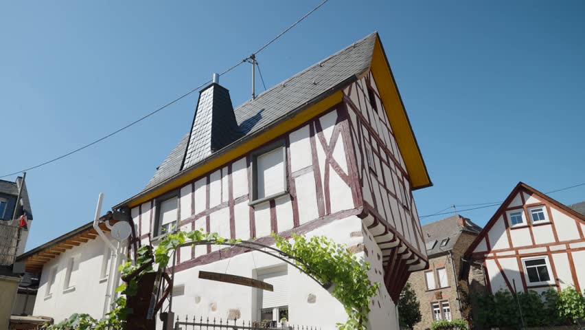 Traditional half-timbered house in the Moselle region of Germany. Historic architecture in a picturesque European village.