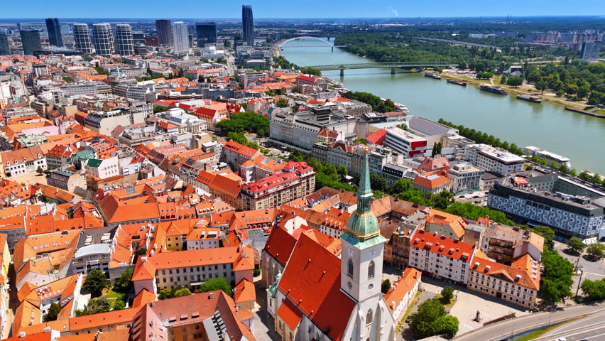 Amazing historical architecture of Bratislava, Slovakia. View on the Danube flowing through the city. Aerial perspective.