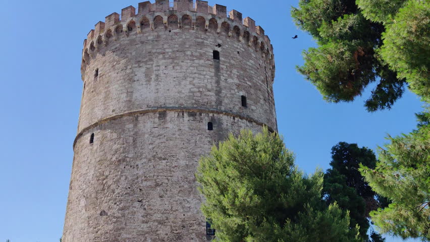 Historic White Tower Of Thessaloniki (Lefkos Pyrgos) In Greece. Low-angle Shot