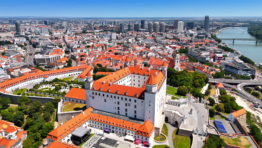 Flying around the Bratislava Castle on sunny day. View on the amazing historical building in the old town near the Danube.