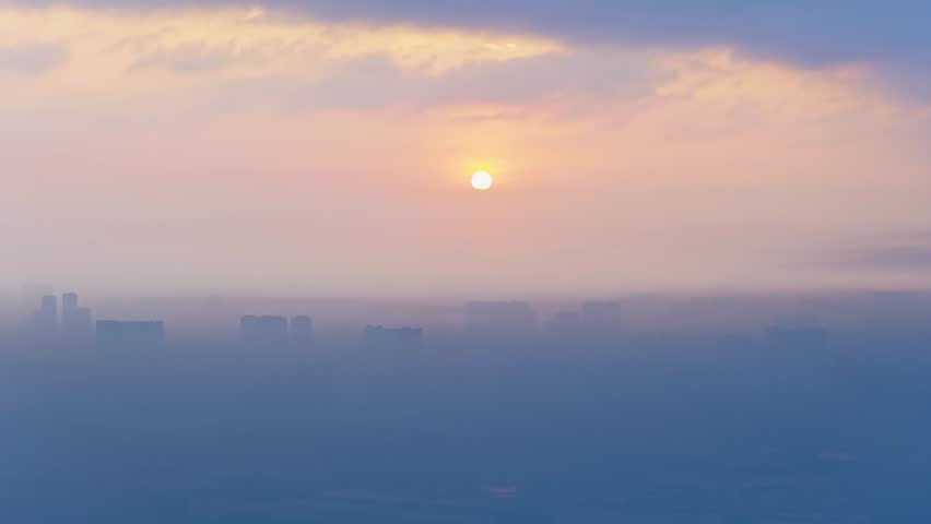 Aerial view of Saigon cityscape at morning with misty sky in Southern Vietnam. Urban development texture, transport infrastructure and green parks