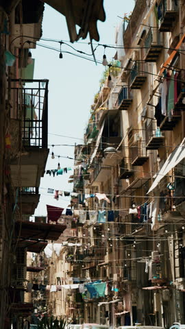 A typical Naples street with laundry hanging on lines strung between buildings