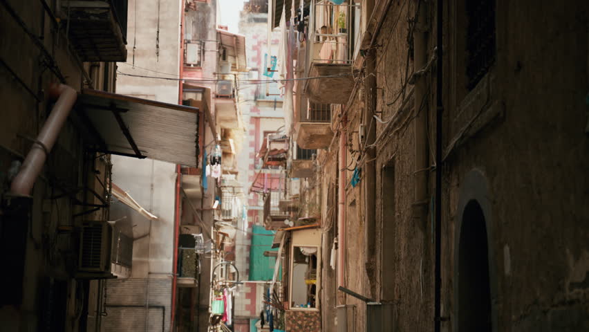 Narrow street in a Naples neighborhood with small balconies