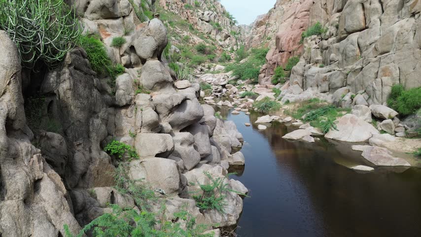 Beautiful rocky canyon with a calm freshwater stream