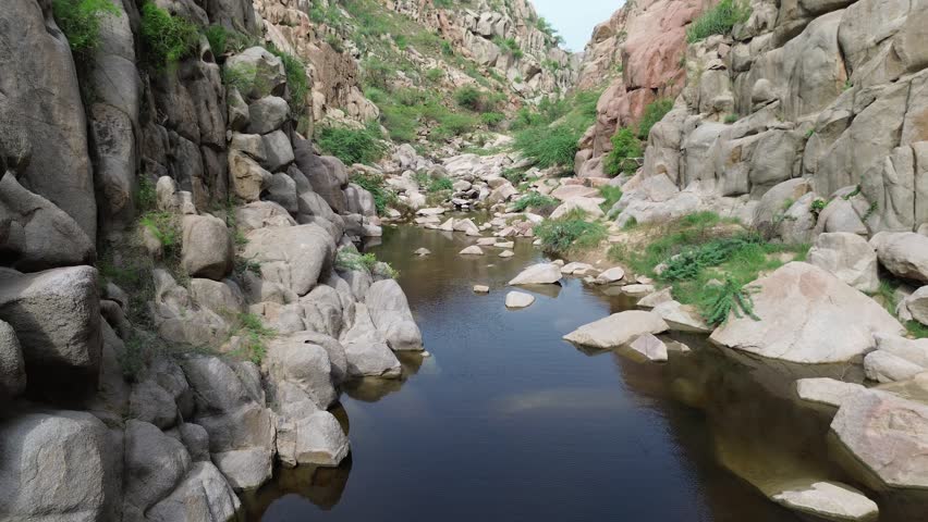 Scenic mountain stream surrounded by rugged rock formations