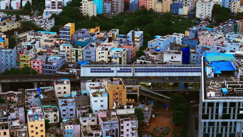 Durgam Cheruvu metro station with metro line, Residential buildings, mobile signal tower and Krishe Sapphire building at madhapur, hyderabad, telangana, india. day time, stable shot, drone shot, 4k.