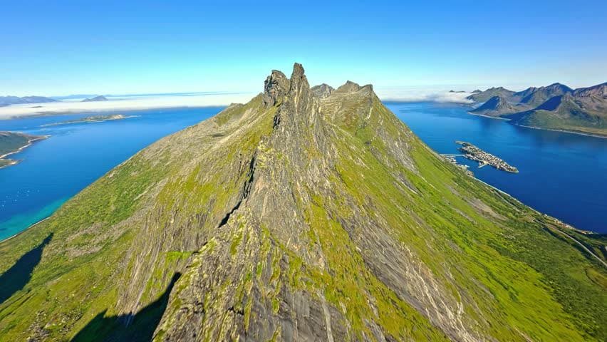Drone Flying Over a Mountain Top and Blue Lake During the Day