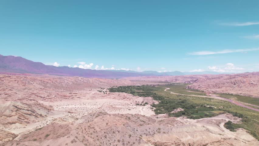 4K drone aerial view of Santa Rosa, Salta, Argentina. Unique white rock formations with geometric shapes and dramatic Andean landscapes shaped by natural erosion.