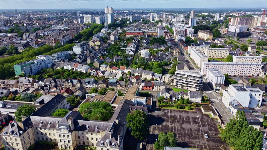 Tour des Horizons skyscraper in in Rennes, France. Aerial forward, cityscape