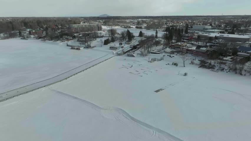 drone flying over the chambly channel in the winter a historic site of canada n fly over the completed channel from the river to the channel