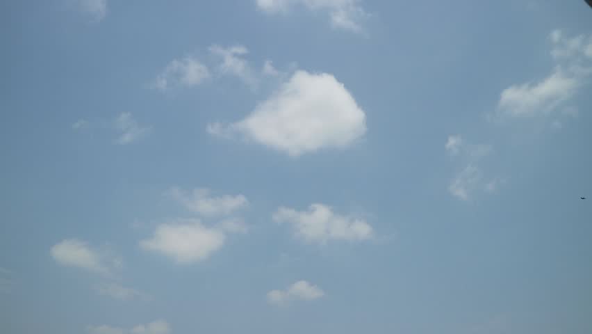 a collection of clouds on a sunny day in the dry season