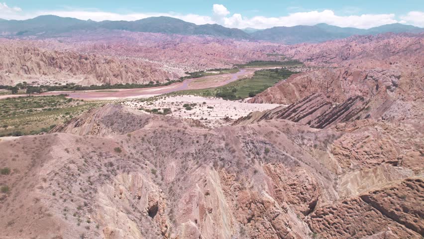 4K drone aerial view of Santa Rosa, Salta, Argentina. Unique white rock formations with geometric shapes and dramatic Andean landscapes shaped by natural erosion.