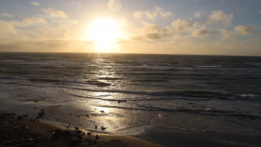 Hirtshals, Denmark Waves on a North Sea beach at sunset