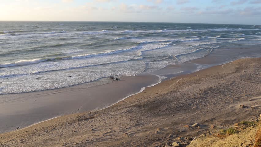 Hirtshals, Denmark Waves on a North Sea beach at sunset