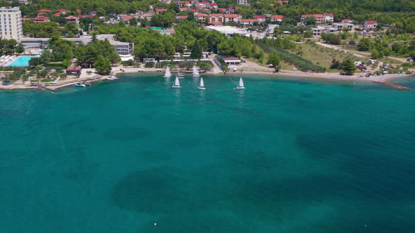 Aerial view of sailboats anchored near the coastal town of Starigrad Paklenica below Velebit mountains in Croatia