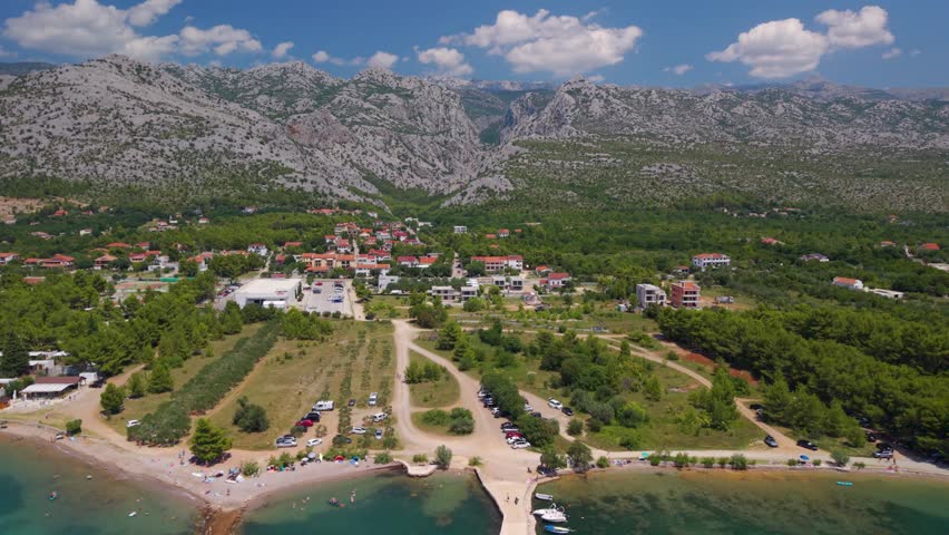 Spectacular aerial view of the Velebit mountains rising directly behind the Adriatic sea in Starigrad Paklenica, Croatia