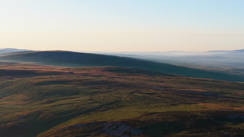 Aerial Over Dramatic Landscape of Brecon Beacons at Sunrise.
