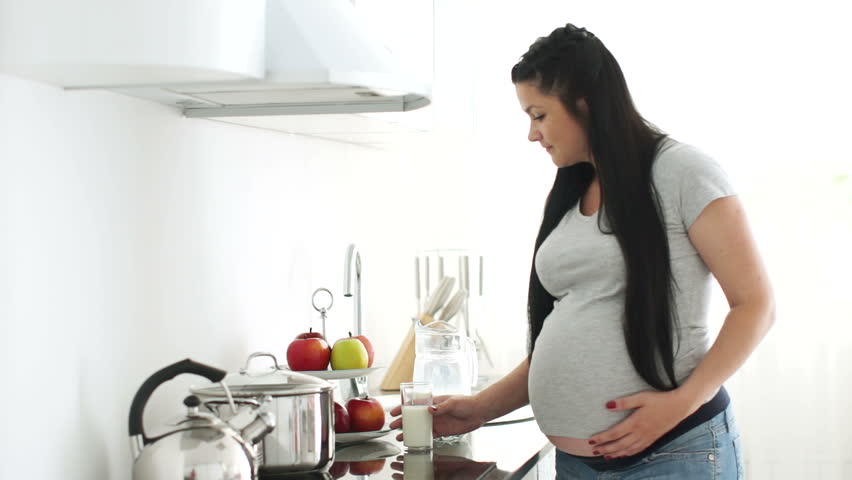 Pregnant woman drinking milk
