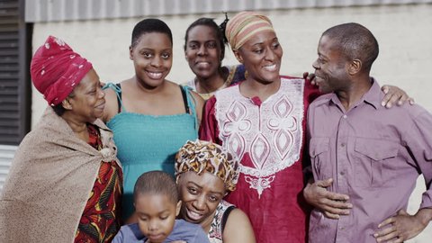 Portrait of a smiling family group from an African village. In slow motion. Stockvideo