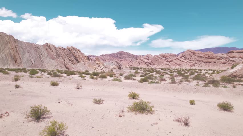 4K drone aerial view of Santa Rosa, Salta, Argentina. Unique white rock formations with geometric shapes and dramatic Andean landscapes shaped by natural erosion.