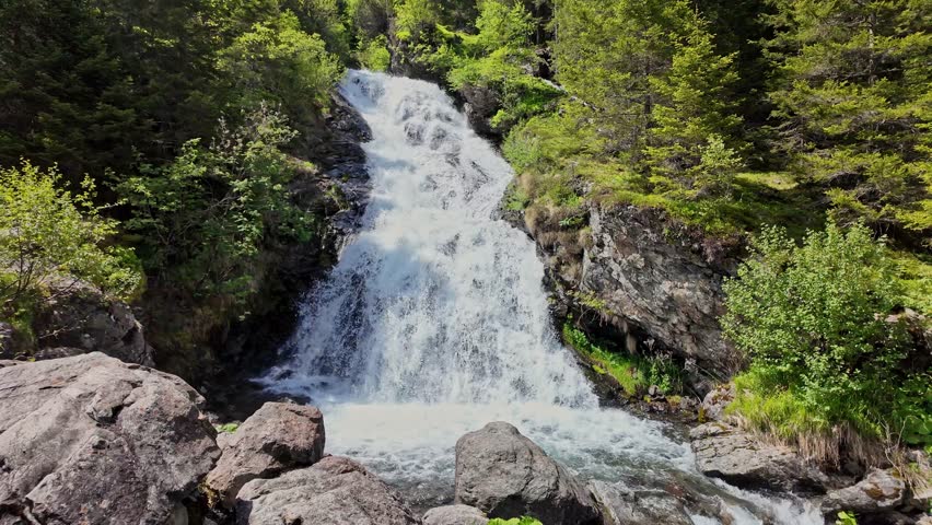 Nature mountain landscape. Rocky water landscape. Nature wildness. Rapid waterfall travel destination. Picturesque waterfall. Travel destination. Scenery waterfall route. Rushing waterfall