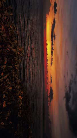 Beautiful sunset over the ocean with dramatic orange sky