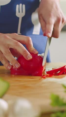 Mastering the art of cutting bell peppers in a cozy kitchen setting