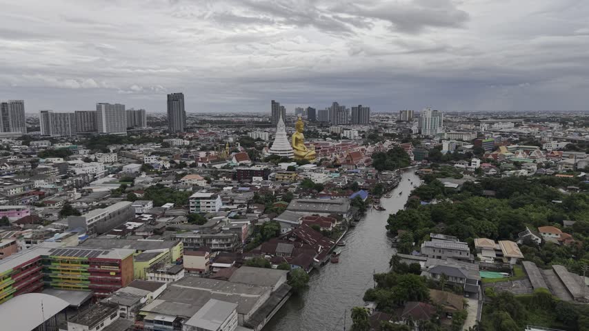 Wat Paknam Bhasicharoen golden big Buddha at the Chao Phraya River. Bangkok, Thailand