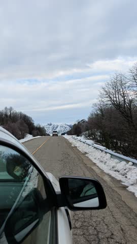 Neuquén, Argentina – July 31, 2026 – Snow-covered road in Patagonia, Argentina, surrounded by mountains.